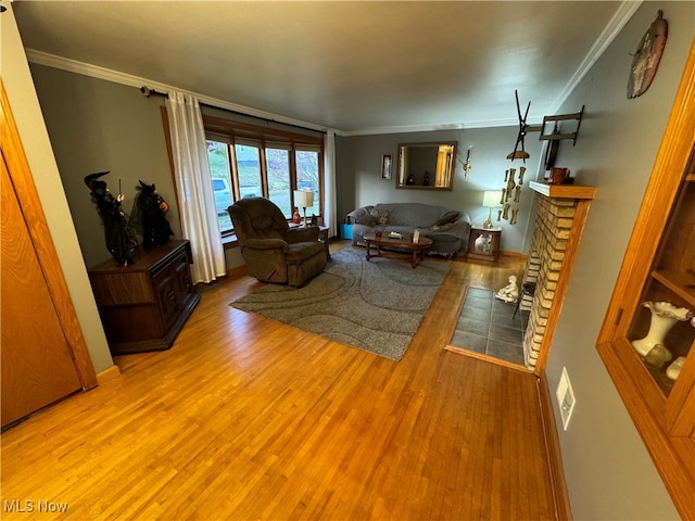 living room with crown molding and light hardwood / wood-style flooring