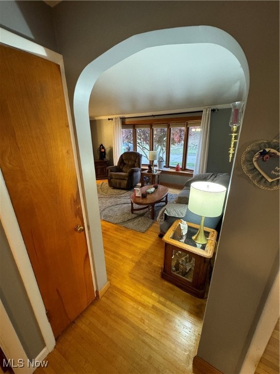 hallway with light hardwood / wood-style floors