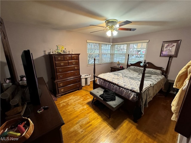 bedroom featuring light hardwood / wood-style floors and ceiling fan