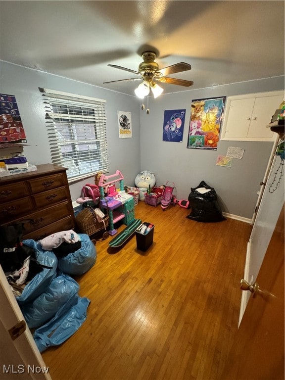 bedroom featuring hardwood / wood-style floors and ceiling fan