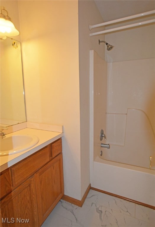 bathroom with shower / bathing tub combination and vanity