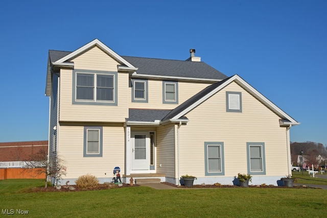 view of front of house with a front lawn