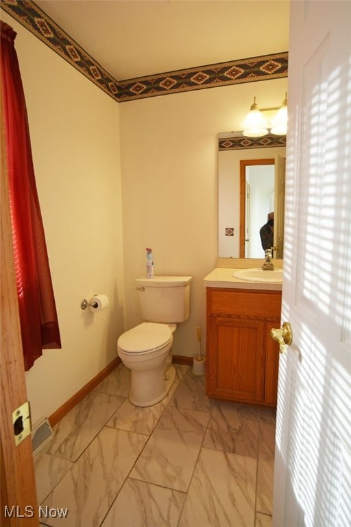 bathroom with vanity and toilet