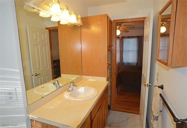 bathroom featuring vanity, hardwood / wood-style flooring, and ceiling fan