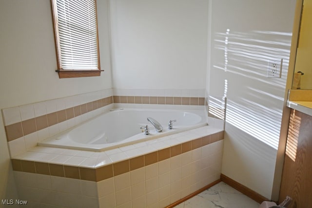 bathroom featuring a relaxing tiled tub