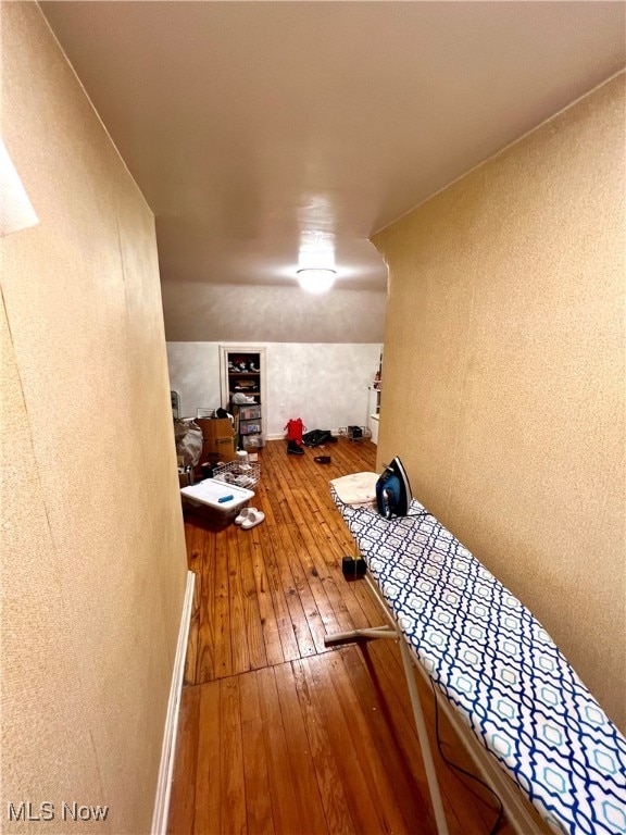 bonus room with hardwood / wood-style floors