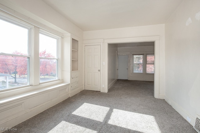 unfurnished bedroom with a closet and carpet