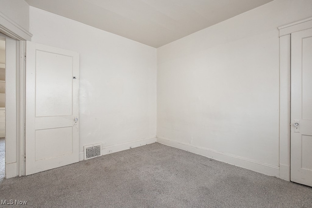 unfurnished room featuring carpet flooring