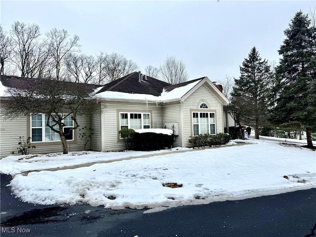 view of front of home with a chimney