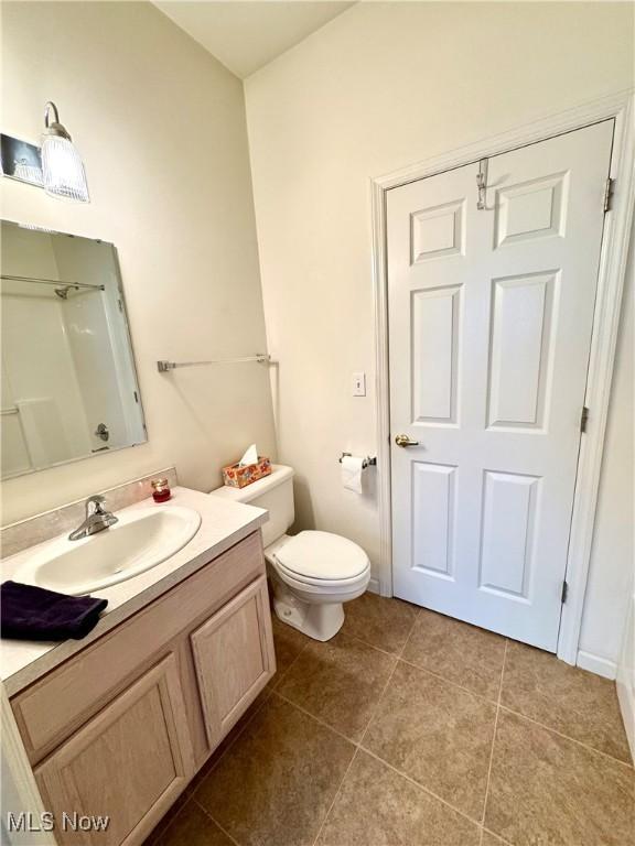 128 Wilcox Rd, Austintown, OH 44515 - full bath with toilet, vanity, and tile patterned floors