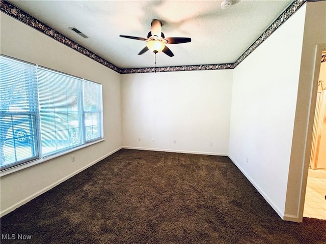 128 Wilcox Rd, Austintown, OH 44515 - carpeted empty room with ceiling fan, visible vents, and baseboards