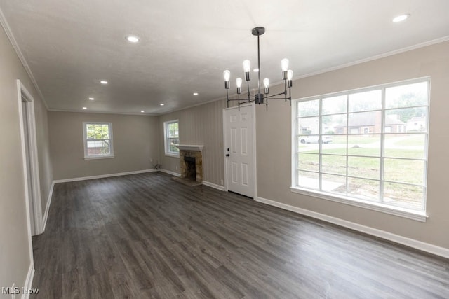 unfurnished living room with a fireplace, crown molding, and dark hardwood / wood-style flooring