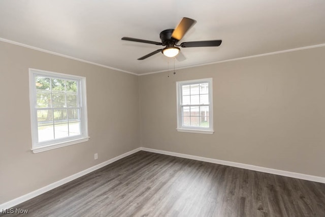 spare room featuring ceiling fan, dark hardwood / wood-style floors, and crown molding