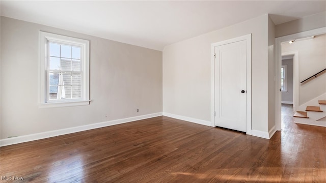 spare room featuring dark hardwood / wood-style flooring