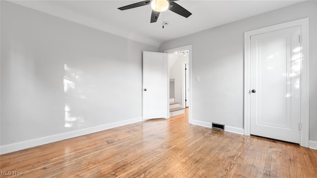 unfurnished bedroom with ceiling fan and light wood-type flooring