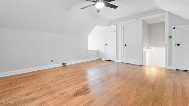 bonus room with ceiling fan, lofted ceiling, and light hardwood / wood-style floors