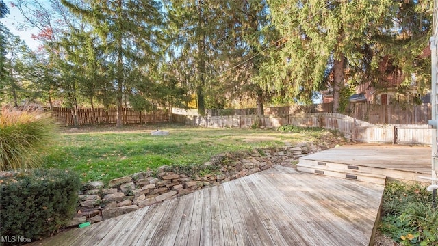 wooden deck with a yard