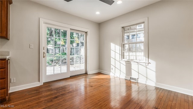 entryway with hardwood / wood-style flooring and ceiling fan