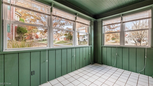 unfurnished sunroom with a wealth of natural light