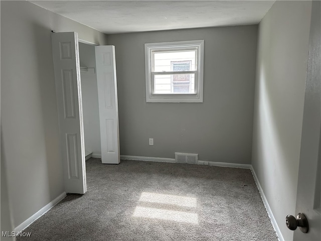 unfurnished bedroom featuring carpet