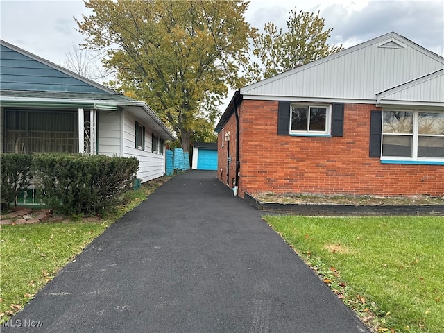 view of property exterior with a yard