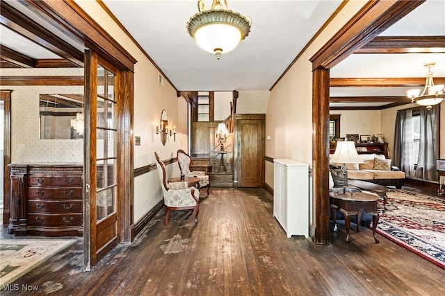 corridor featuring ornamental molding, dark wood-type flooring, and beamed ceiling