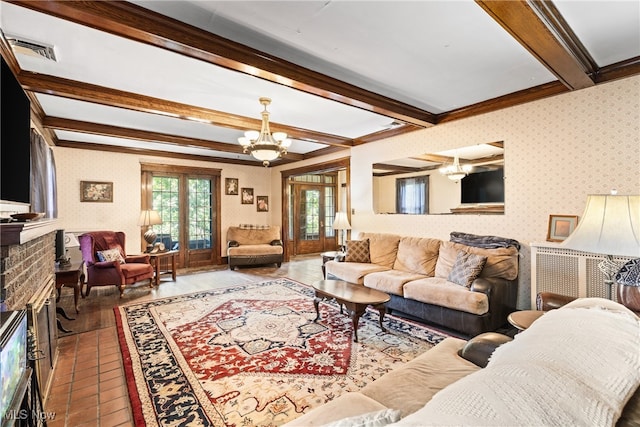 living room featuring a notable chandelier, a brick fireplace, and beam ceiling