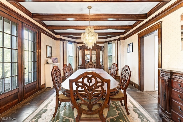 dining space with dark wood-type flooring, crown molding, beam ceiling, and an inviting chandelier