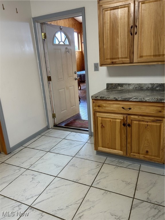 kitchen featuring dark stone counters