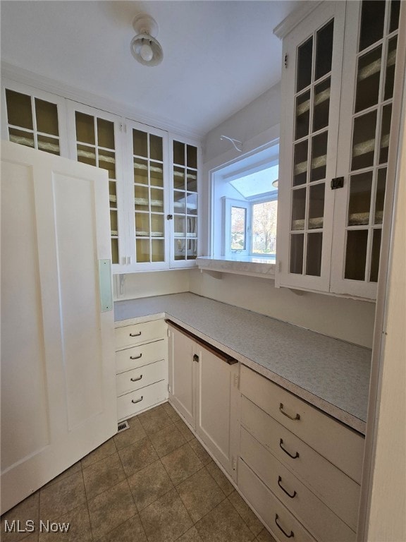 kitchen with white cabinets