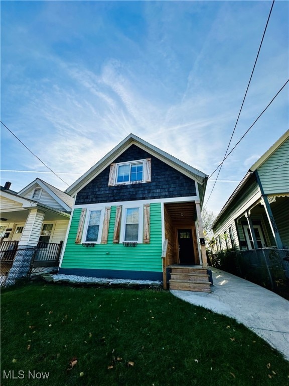 bungalow-style house featuring a front yard and a porch