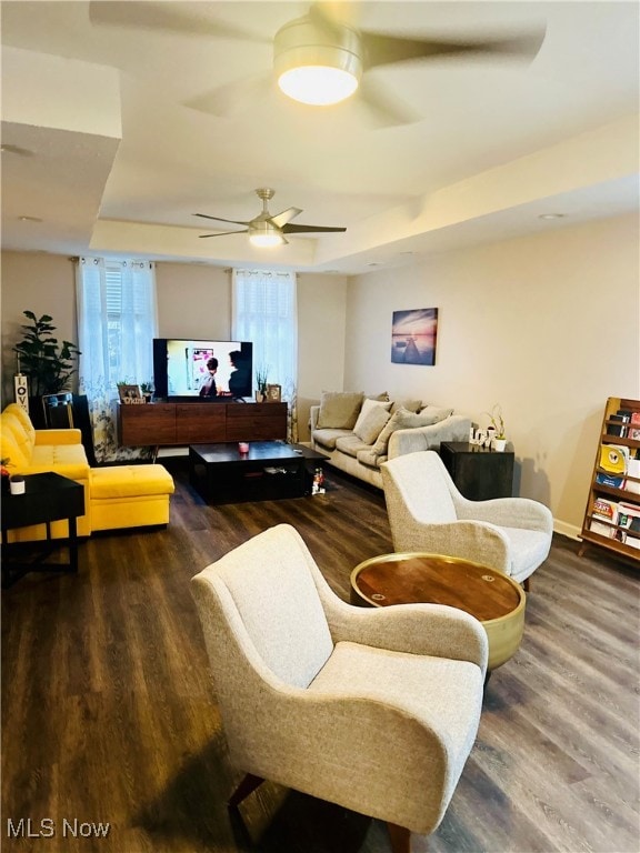 living room featuring dark hardwood / wood-style flooring and plenty of natural light