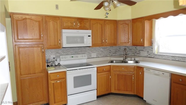 kitchen featuring ceiling fan, sink, white appliances, decorative backsplash, and light tile patterned floors