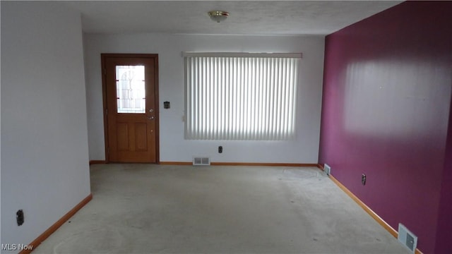 interior space featuring light colored carpet