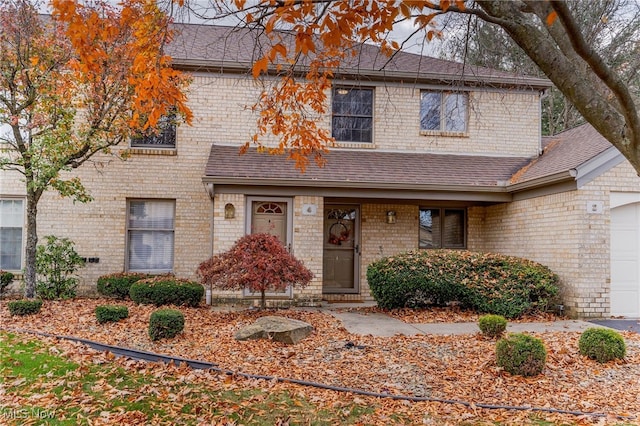 front of property with a garage