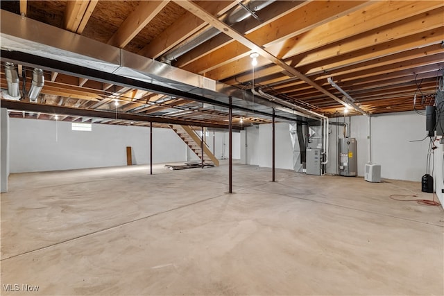 basement with water heater and heating unit