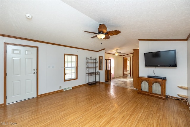 unfurnished living room with ceiling fan, a textured ceiling, light hardwood / wood-style flooring, and lofted ceiling