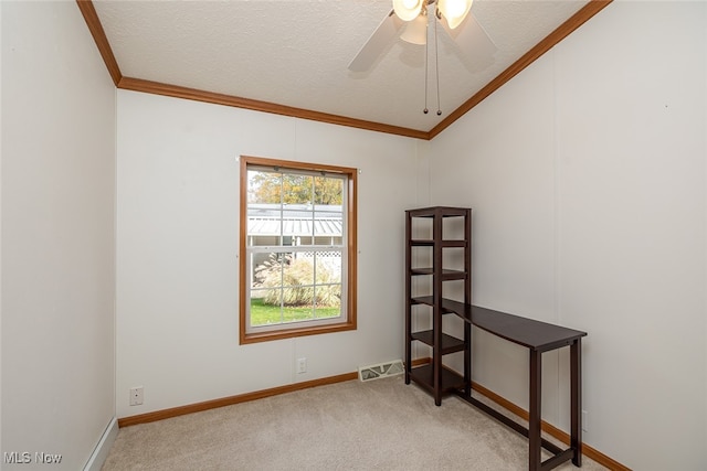 carpeted empty room with ceiling fan, a textured ceiling, and lofted ceiling