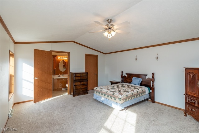 bedroom featuring lofted ceiling, light colored carpet, ceiling fan, and ensuite bath