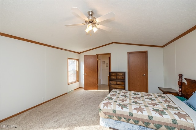 bedroom featuring ornamental molding, ceiling fan, a textured ceiling, light colored carpet, and vaulted ceiling