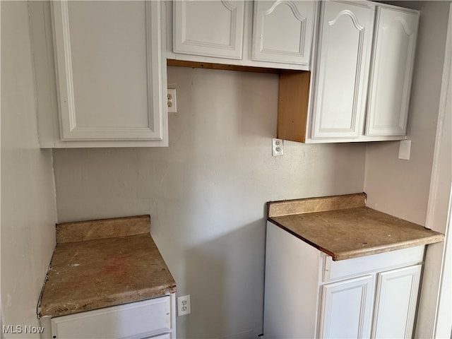 kitchen featuring white cabinets