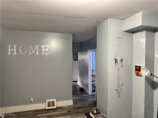 hallway featuring dark wood-type flooring