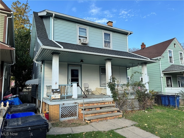 front facade featuring a front yard and a porch