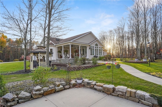 exterior space with a front yard and a gazebo