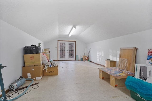 additional living space featuring lofted ceiling and french doors