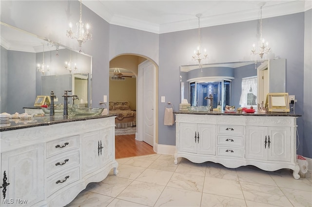 bathroom with vanity, hardwood / wood-style flooring, and crown molding