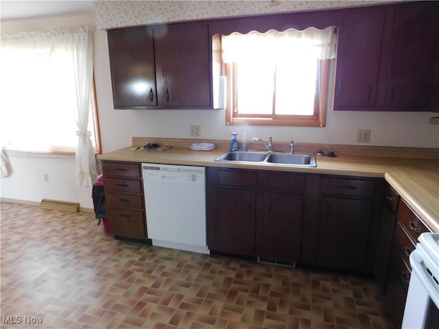 kitchen with white appliances, sink, and dark brown cabinetry