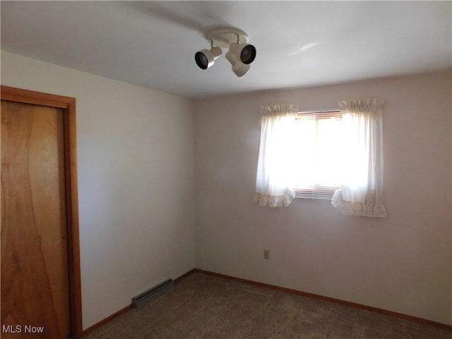 unfurnished room featuring carpet