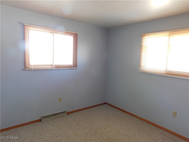 spare room with carpet flooring and a wealth of natural light