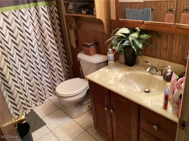 bathroom featuring vanity, tile patterned floors, toilet, and a shower with curtain